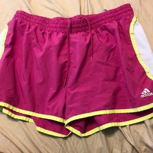 Pink and yellow Adidas running shorts
